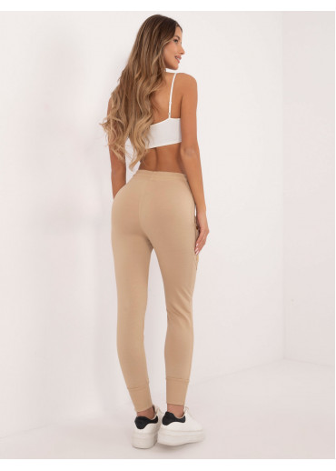 Béžovo hnedé tepláky zdobené gombíkmi