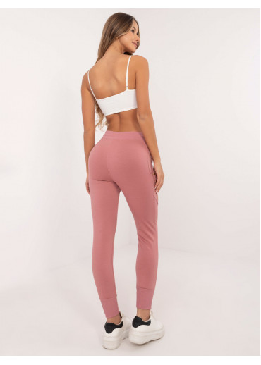 Tmavopúdrovo ružové tepláky zdobené gombíkmi