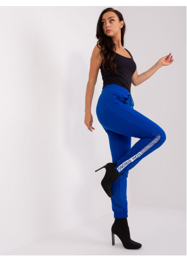 Kobaltovo modré tepláky s lampasom